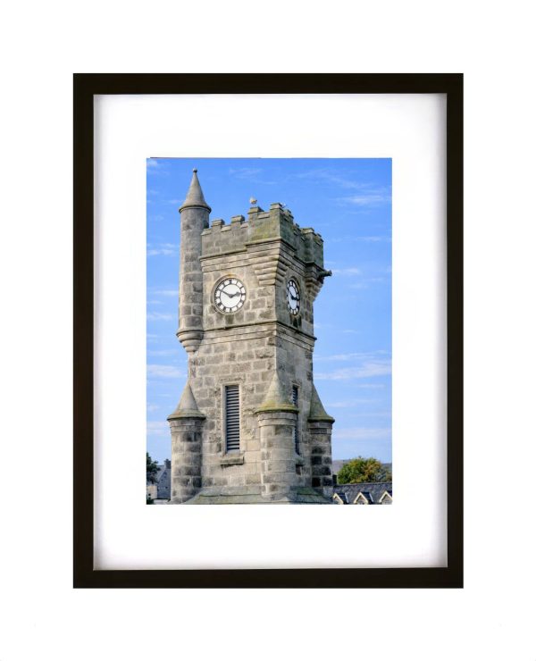 Brora War Memorial clock tower in Brora Scotland historic stone monument