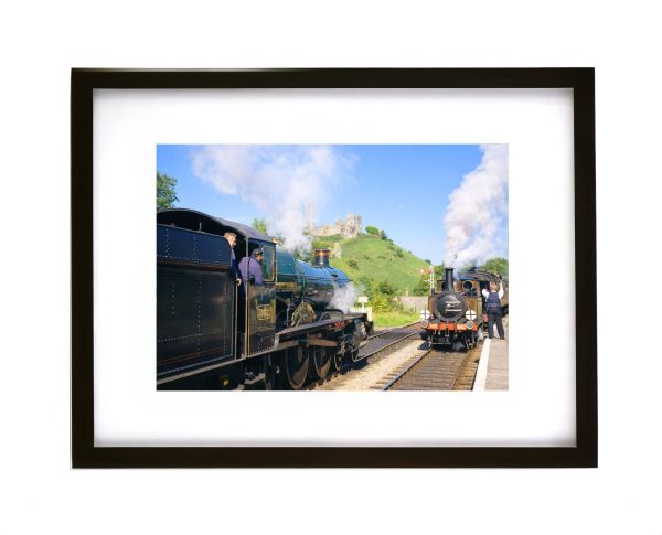 Erlestoke Manor steam locomotive at Corfe Castle station with Corfe Castle ruins Dorset heritage railway photograph