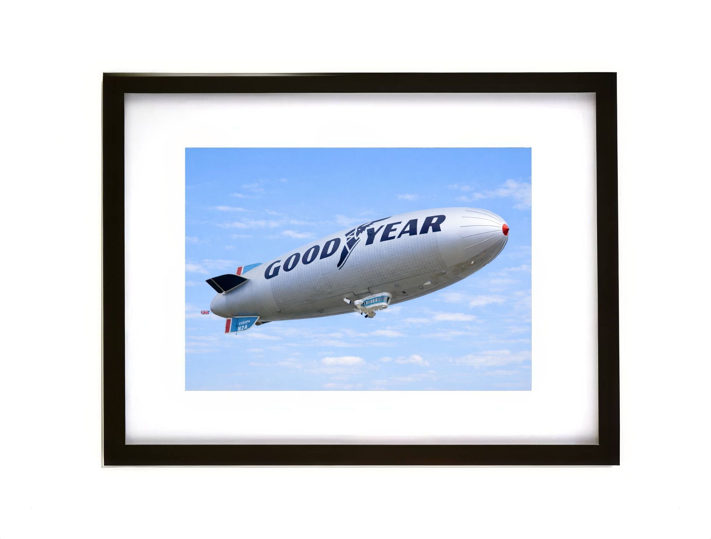Goodyear Blimp Europa N2A airship flying in blue sky aviation photograph