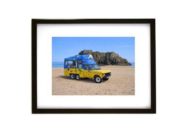 Ice cream van on Tenby Beach with St Catherine’s Island Pembrokeshire Wales