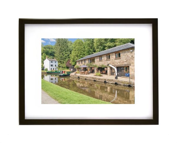 Llanfoist Wharf Monmouthshire and Brecon Canal near Abergavenny Wales canal boats and historic stone buildings
