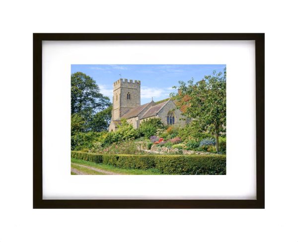 Historic Quantoxhead Church surrounded by gardens in the Somerset countryside